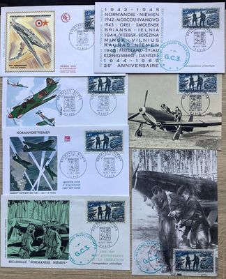 a lot of stamps on a table with a picture of a plane