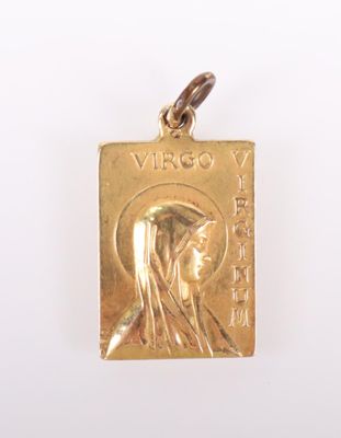 an image of a gold pendant with a picture of jesus on it