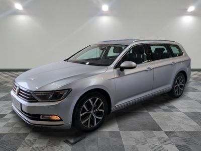 the volkswagen passat is parked in a large room with a checkered floor