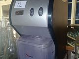 a coffee machine sitting on top of a counter in a kitchen