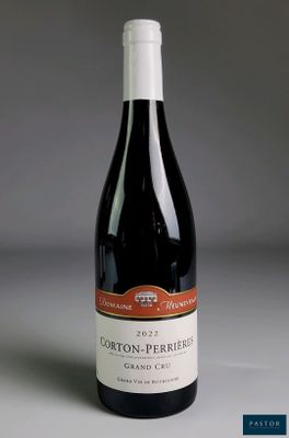 the bottle of wine is sitting on the table ready to be eaten
