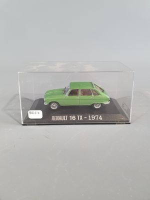 the green car is in a clear box on a white surface