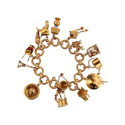 an image of a gold bracelet with various charms on a white background