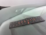 a sticker on the windshield of a car that says v - auto