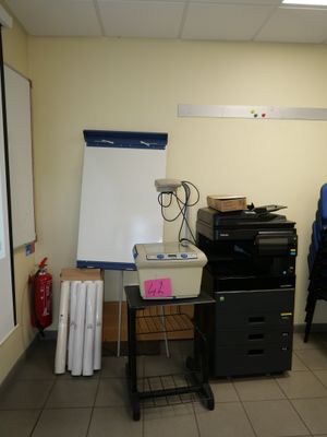 a picture of a room with a printer and a projector