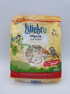 un sac de graines pour oiseaux posé sur une table blanche