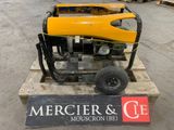 a small generator on a pallet in a warehouse