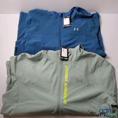 two men ' s jackets are sitting on top of each other