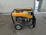 a small generator that is sitting on the ground