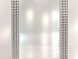 l'image d'une photo représentant un miroir posé sur une surface blanche