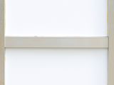 a close up of a white window frame with a window pane