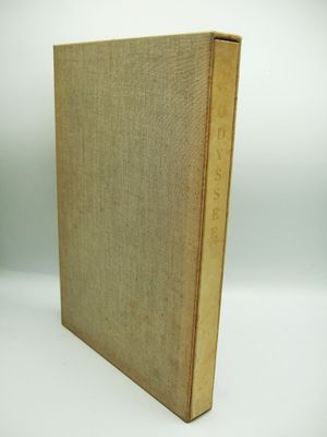 an old book sitting on top of a white surface
