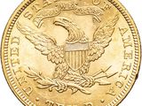 a close up of a gold coin with an eagle on it