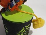 an orange ball sitting on top of a green box