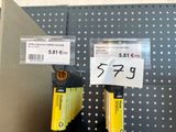 two yellow keys that are on display in a store
