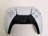 a close up of a video game controller on a table