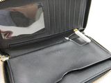 the inside of a black wallet with a mirror on it