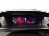 the dashboard of a car with a digital display in the center