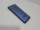 a close up of a cell phone sitting on a table