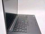 a laptop computer that is open on a white surface