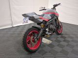 a motorcycle that is sitting on the floor in the room
