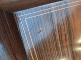 a close up of a wooden cabinet with a clock on it