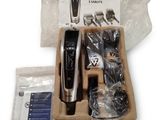 a black and silver electric hair clipper in a box