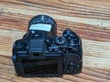 a camera that is sitting on a wooden table