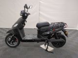 a scooter that is parked on a checkered floor