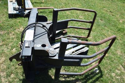 an image of a fork attachment in the grass