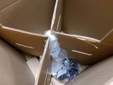 a cardboard box with a bottle of water inside of it