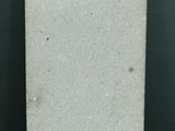 a picture of a white plate on a black table