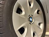 tire of a bmw car on display in a showroom
