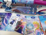several children ' s books and toothbrushes sitting on a table