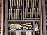many different types of silverware in a box