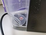 a blender that is sitting on a counter next to a bottle