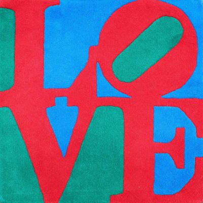 a close up of a red and green love sign on a blue background