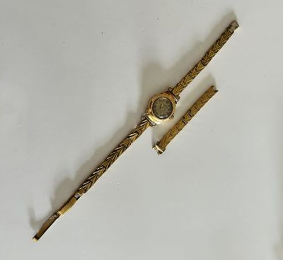 an image of a gold watch and a pen on a white surface