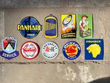 many different stickers on the wall of a building