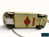 a toy truck that is connected to a power cord