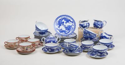 many blue and white china dishes and cups and saucers