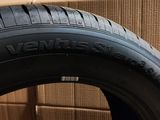 a close up of a tire with a box in the background