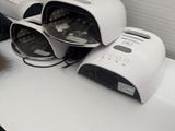 three toasters sitting on a counter next to a toaster
