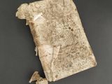 an old book with a piece of paper sticking out of it