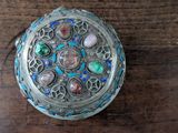 a silver box with a colorful design on it