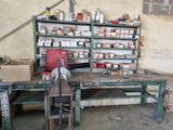 a workbench with a lot of supplies on it