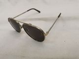 a close up of a pair of sunglasses on a white surface