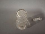 a glass of water and a toothbrush sitting on a table