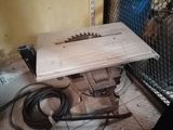 a table with a saw on top of it in a room