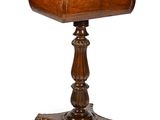 an old wooden table with a drawer on top of it